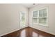 Bright room featuring a rear entry door and a window with slatted blinds at 236 Lynchwick Ln, Durham, NC 27703
