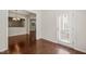View of room with hardwood floors and access to Kitchen, Stairs and rear patio at 236 Lynchwick Ln, Durham, NC 27703