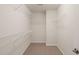Spacious walk-in closet featuring ample shelving for optimal organization and storage at 236 Lynchwick Ln, Durham, NC 27703