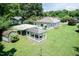 An aerial view of a home's spacious backyard featuring a gazebo, shed, and covered parking at 310 Spring St, Durham, NC 27703