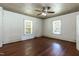 Empty bedroom featuring hardwood flooring, ceiling fan, and natural light at 310 Spring St, Durham, NC 27703