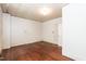 Bedroom with hardwood floors, decorative wallpaper, and paneled ceiling at 310 Spring St, Durham, NC 27703
