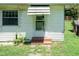 A close up of the side entry of the home with brick steps at 310 Spring St, Durham, NC 27703