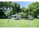 A well-maintained gazebo in a lush backyard, offering a relaxing outdoor space at 310 Spring St, Durham, NC 27703