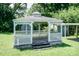 The white lattice gazebo has a detailed decorative roof at 310 Spring St, Durham, NC 27703
