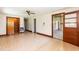 A spacious living room with hardwood-style floors, white walls, and wooden door and window trim at 310 Spring St, Durham, NC 27703