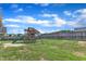 Backyard with a playset, grass, and a wooden fence surrounding the yard at 3106 Royal Deeside Ct, Zebulon, NC 27597