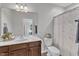 Well-lit bathroom with vanity, and decorative shower curtain at 3106 Royal Deeside Ct, Zebulon, NC 27597