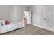 Cozy bedroom featuring neutral walls, carpeted floors and door to hallway at 3106 Royal Deeside Ct, Zebulon, NC 27597