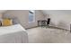 Bedroom with neutral carpet, a bed with colorful pillows, and a desk near a window for a comfortable space at 3106 Royal Deeside Ct, Zebulon, NC 27597