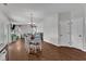 Open-concept living and dining area with wood floors and natural light from sliding glass doors at 3106 Royal Deeside Ct, Zebulon, NC 27597