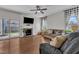 Comfortable living room with hardwood floors, a fireplace, and sliding door to the backyard at 3106 Royal Deeside Ct, Zebulon, NC 27597