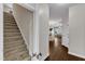 Staircase leading to the upper level with an open view into the kitchen, dining area, and living room at 3106 Royal Deeside Ct, Zebulon, NC 27597