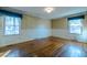 Bedroom featuring hardwood flooring, large windows, and plenty of natural light at 3129 Barwell Rd, Raleigh, NC 27610