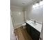 Bathroom showcasing a single vanity and shower over tub at 3212 Potthast Ct, Raleigh, NC 27529