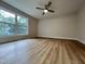 Large bedroom with big window and ceiling fan at 3212 Potthast Ct, Raleigh, NC 27529