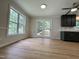 Open floor plan showcasing updated kitchen cabinets, countertops, and stainless ceiling fan at 3212 Potthast Ct, Raleigh, NC 27529