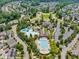 Aerial view showcasing the community pool, clubhouse and surrounding homes at 322 Tobacco Farm Way, Chapel Hill, NC 27516