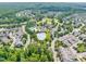 A Primary-planned community boasts a pool, clubhouse, and plentiful parking in a lush green setting at 322 Tobacco Farm Way, Chapel Hill, NC 27516