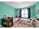 Comfortable bedroom with two beds, colorful decor and large window at 322 Tobacco Farm Way, Chapel Hill, NC 27516