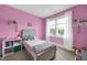 Cozy bedroom with pink walls, plush decor, and natural light at 322 Tobacco Farm Way, Chapel Hill, NC 27516