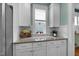 Kitchen with white cabinets, granite counters, and a window over the counter, for natural light at 322 Tobacco Farm Way, Chapel Hill, NC 27516