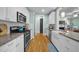 Updated kitchen featuring granite counters, stainless steel appliances, and hardwood floors at 322 Tobacco Farm Way, Chapel Hill, NC 27516