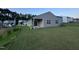 A home's backyard featuring well-manicured grass and covered porch at 3428 Pinnacle Peak Dr, Raleigh, NC 27604