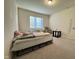 Bright bedroom with neutral walls, carpet floors, and large window at 3428 Pinnacle Peak Dr, Raleigh, NC 27604
