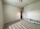 Bedroom with neutral walls and carpet plus closet and doorways at 3428 Pinnacle Peak Dr, Raleigh, NC 27604