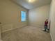 Bright bedroom with neutral carpet and walls with a window at 3428 Pinnacle Peak Dr, Raleigh, NC 27604
