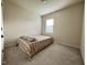 Bedroom with neutral walls and carpet plus a window at 3428 Pinnacle Peak Dr, Raleigh, NC 27604