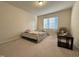 Bright bedroom with neutral walls, carpet floors, and large window at 3428 Pinnacle Peak Dr, Raleigh, NC 27604