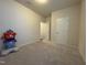 Bedroom with neutral walls and carpet plus closet and doorways at 3428 Pinnacle Peak Dr, Raleigh, NC 27604