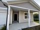 Inviting entryway with stylish front door, covered porch, and well-manicured landscaping at 3428 Pinnacle Peak Dr, Raleigh, NC 27604