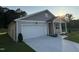 Charming single-Gathering home with a two-car garage and well-manicured lawn on a sunny day at 3428 Pinnacle Peak Dr, Raleigh, NC 27604
