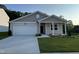 Charming single-Gathering home with a two-car garage and well-manicured lawn at 3428 Pinnacle Peak Dr, Raleigh, NC 27604