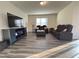 Spacious living room features vinyl floors, a large window, and comfortable seating at 3428 Pinnacle Peak Dr, Raleigh, NC 27604
