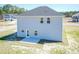 Back exterior showcasing siding, windows, door to patio, and neat backyard space at 346 New Twin Branch Ct, Smithfield, NC 27577