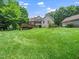 Well-manicured backyard featuring a deck and beautiful landscaping at 3581 Boulder Ct, Wake Forest, NC 27587