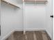 Walk-in closet features carpet and built-in shelving for organized storage in the house at 3581 Boulder Ct, Wake Forest, NC 27587