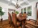 Formal dining room features coffered ceilings, a chandelier, and natural light from large windows at 3581 Boulder Ct, Wake Forest, NC 27587
