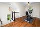 Exercise room featuring hardwood floors, pendant lights, and exercise equipment at 3581 Boulder Ct, Wake Forest, NC 27587