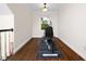 Exercise room featuring hardwood floors, pendant lights, and exercise equipment at 3581 Boulder Ct, Wake Forest, NC 27587