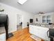 Inviting kitchen area with white cabinets, stainless steel sink, and a view of the living area, perfect for entertaining at 3581 Boulder Ct, Wake Forest, NC 27587
