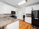 The kitchen features granite countertops, stainless steel appliances, and white cabinetry at 3581 Boulder Ct, Wake Forest, NC 27587