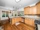 Spacious kitchen featuring a breakfast bar, stainless steel appliances, and granite countertops at 3581 Boulder Ct, Wake Forest, NC 27587
