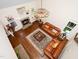 Sunlit living room showcasing a fireplace, hardwood floors, and an ornate chandelier at 3581 Boulder Ct, Wake Forest, NC 27587