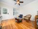Cozy living room featuring hardwood floors, natural light, and comfortable seating, ideal for relaxation and gatherings at 3581 Boulder Ct, Wake Forest, NC 27587