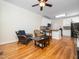 Open-concept living area with hardwood floors seamlessly connecting to the kitchen, perfect for modern living at 3581 Boulder Ct, Wake Forest, NC 27587